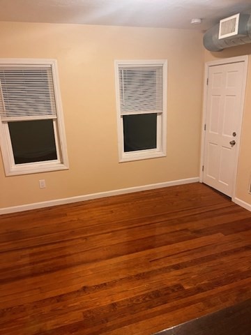 52 Winter Street Taunton, MA 02780 - Photo 12 of 21 a view of an empty room with wooden floor and a window