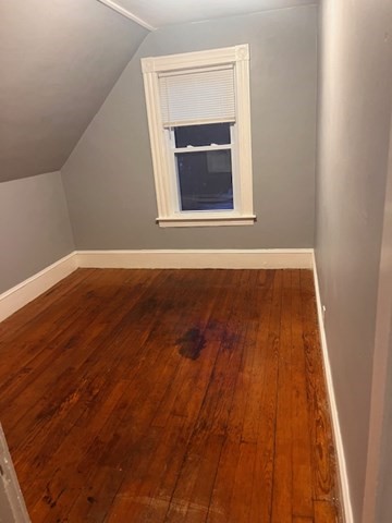52 Winter Street Taunton, MA 02780 - Photo 19 of 21 a view of an empty room with wooden floor and a window