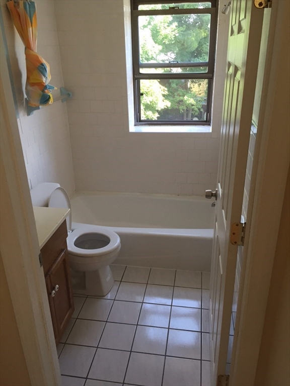52 Winter Street Taunton, MA 02780 - Photo 21 of 21 a bathroom with a toilet a sink and bathtub