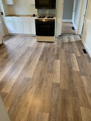 52 Winter Street Taunton, MA 02780 - Photo 3 of 21 a view of kitchen with wooden floor and electronic appliances