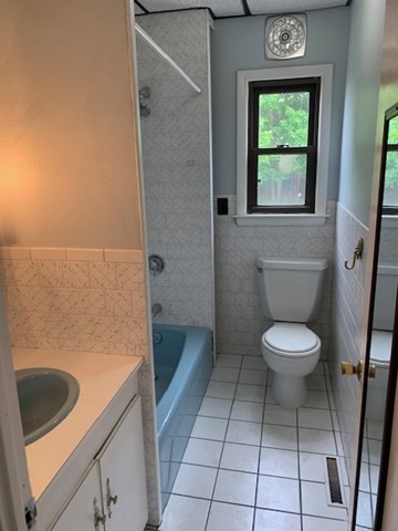 52 Winter Street Taunton, MA 02780 - Photo 7 of 21 a bathroom with a toilet a sink and a shower