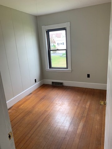 52 Winter Street Taunton, MA 02780 - Photo 8 of 21 an empty room with wooden floor and windows