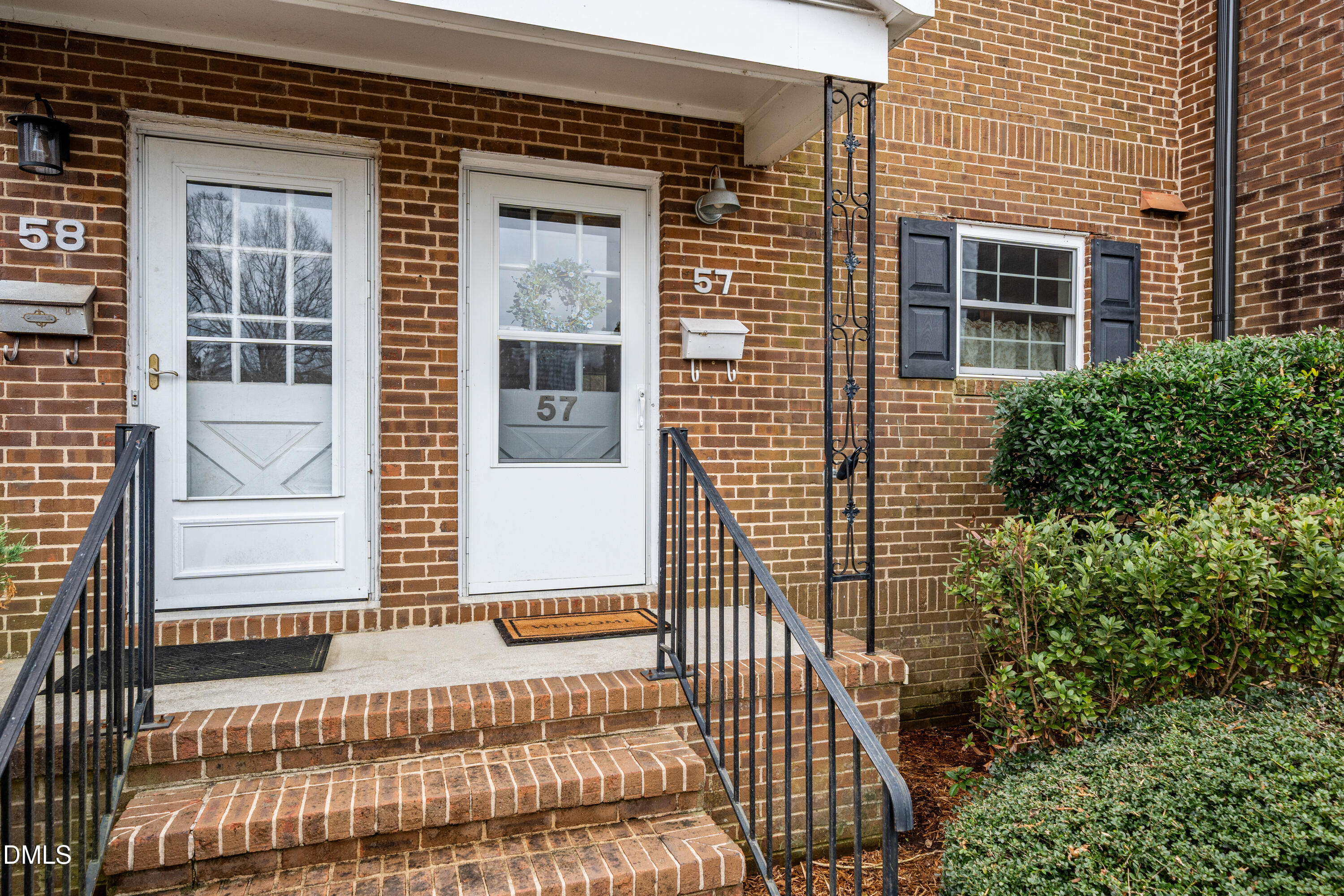 400 Davie Road, Unit 57 Carrboro, NC 27510 - Photo 2 of 28 a view of a house with a door and wooden floor