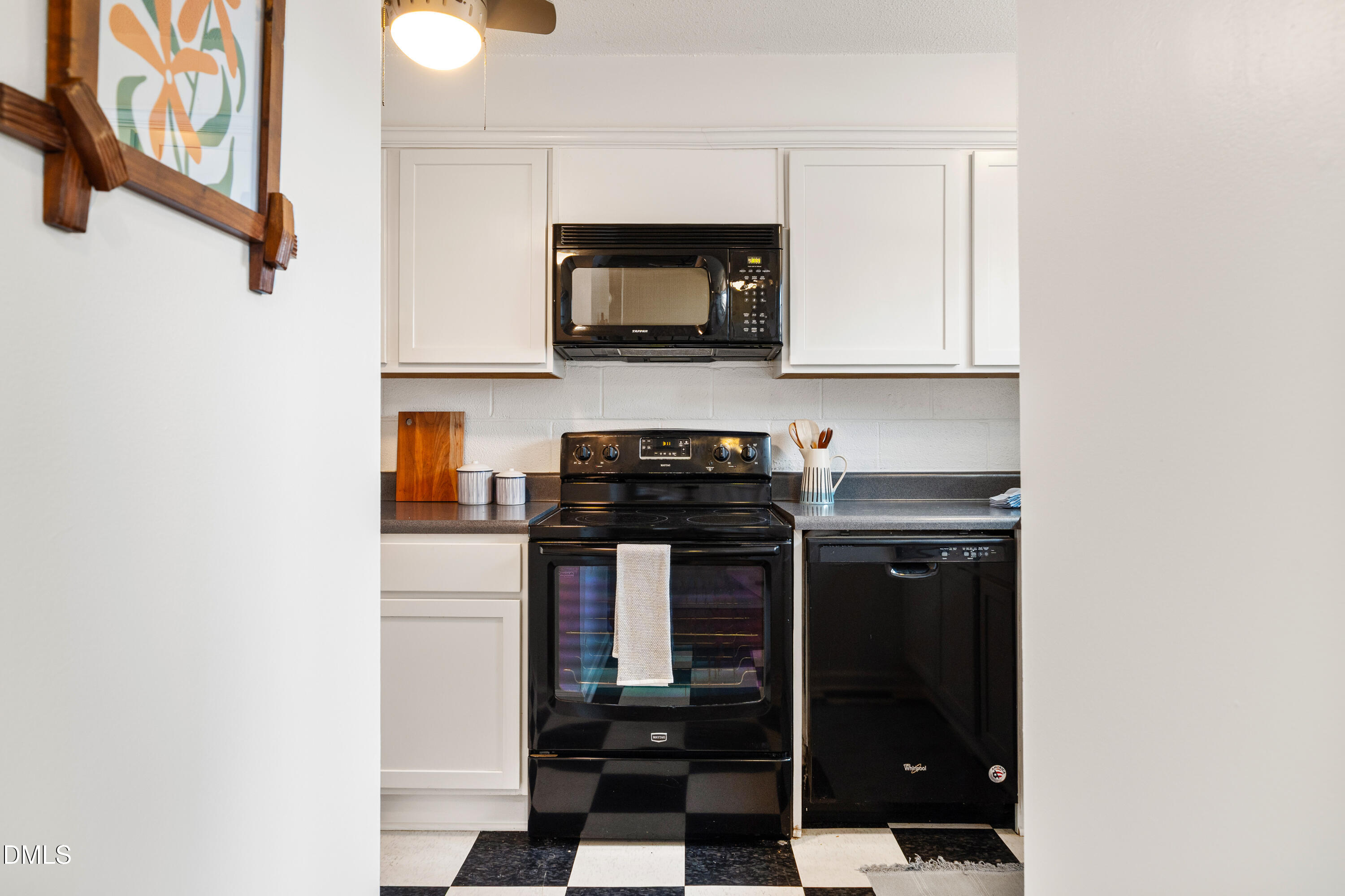 400 Davie Road, Unit 57 Carrboro, NC 27510 - Photo 6 of 28 a kitchen with a stove and a microwave