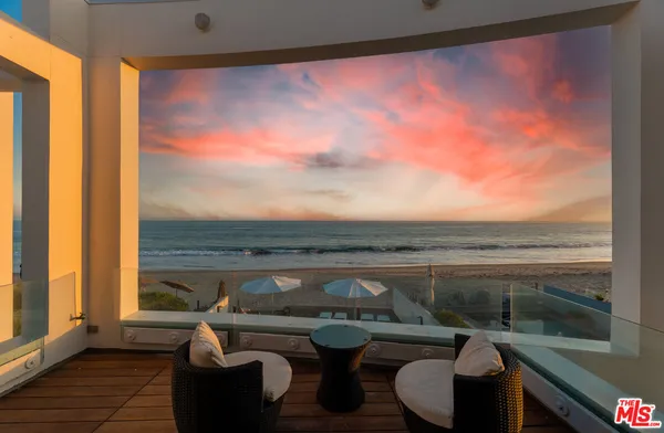 a view of a hallway with stairs