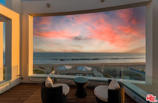 a view of a hallway with stairs
