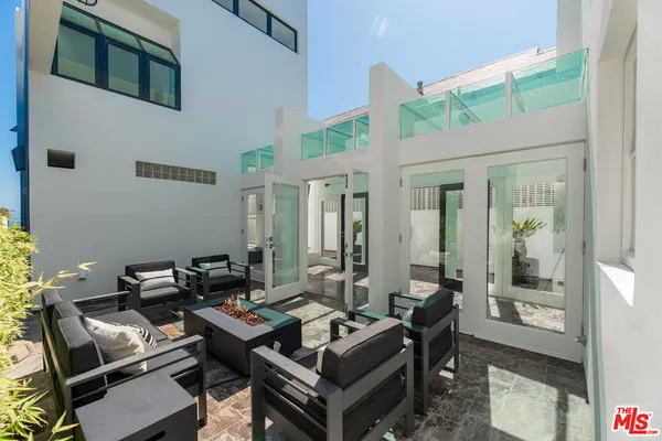 a bathroom with a shower and a sink