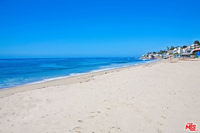a living room with furniture fireplace and a table