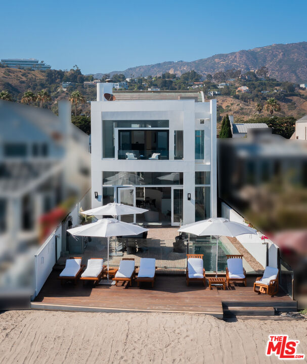 23754 Malibu Road Malibu, CA 90265 - Photo 49 of 59 a view of a patio with couches and potted plants