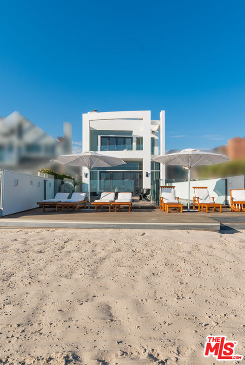 23754 Malibu Road Malibu, CA 90265 - Photo 59 of 59 a front view of a building with cars parked