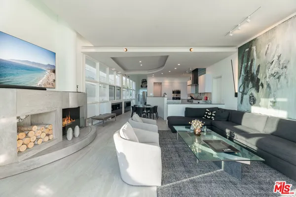 a dining room with furniture and a fireplace