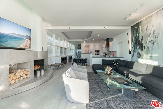 a dining room with furniture and a fireplace