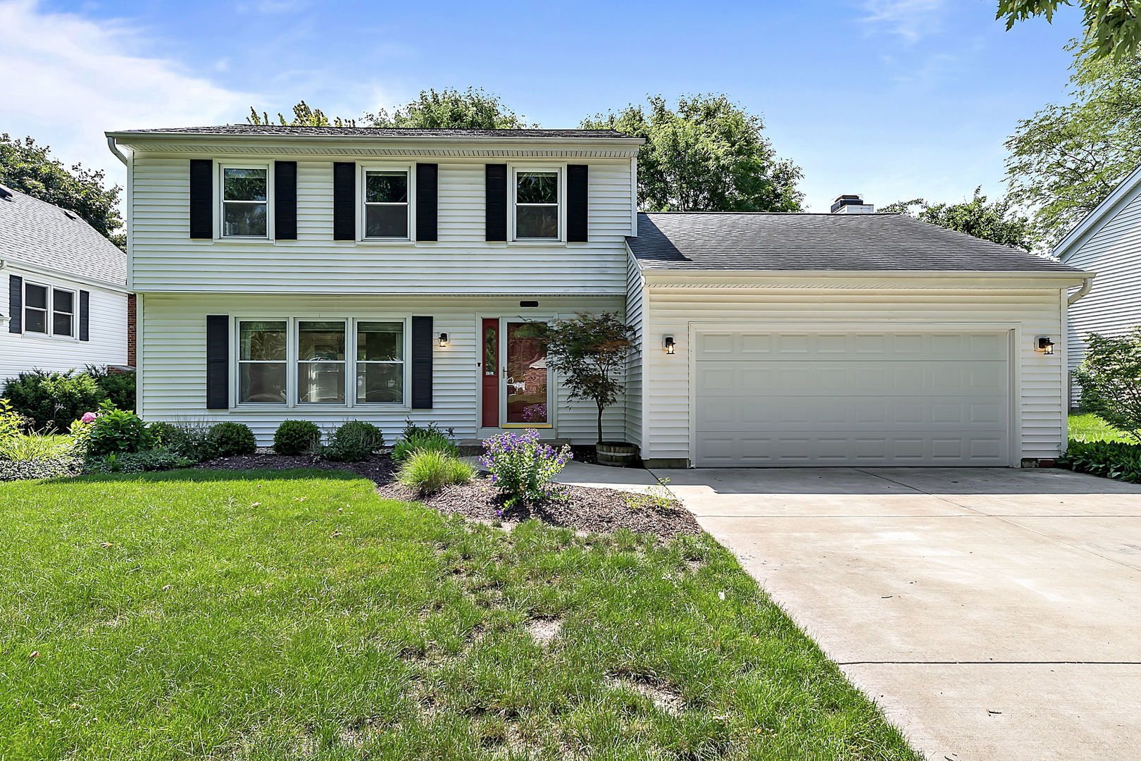 2080 Springside Drive Naperville, IL 60565 - Photo 1 of 31 a front view of a house with a yard and garage