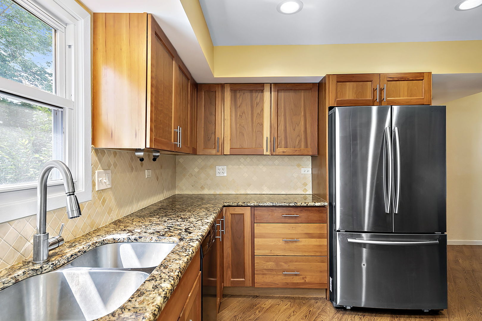 2080 Springside Drive Naperville, IL 60565 - Photo 12 of 31 a kitchen with a refrigerator and a sink
