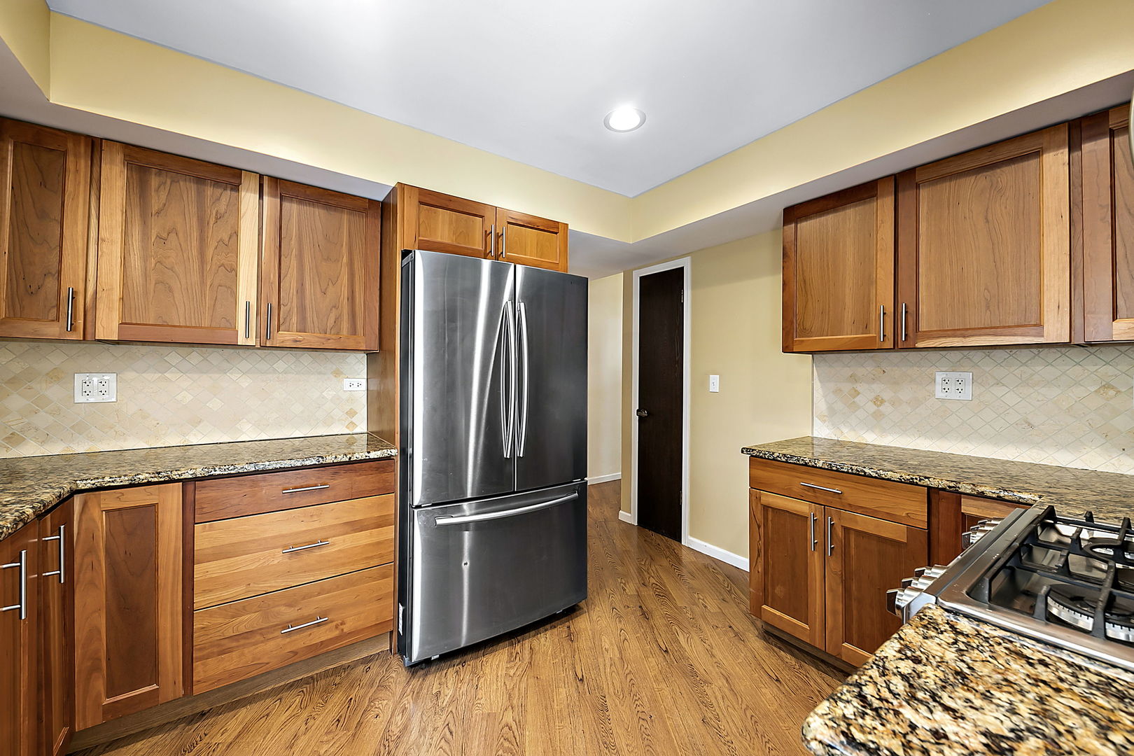 2080 Springside Drive Naperville, IL 60565 - Photo 13 of 31 a kitchen with a refrigerator sink and cabinets