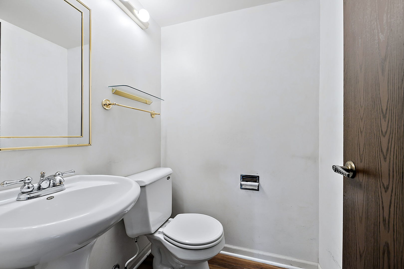 2080 Springside Drive Naperville, IL 60565 - Photo 19 of 31 a white toilet sitting next to a bathroom sink