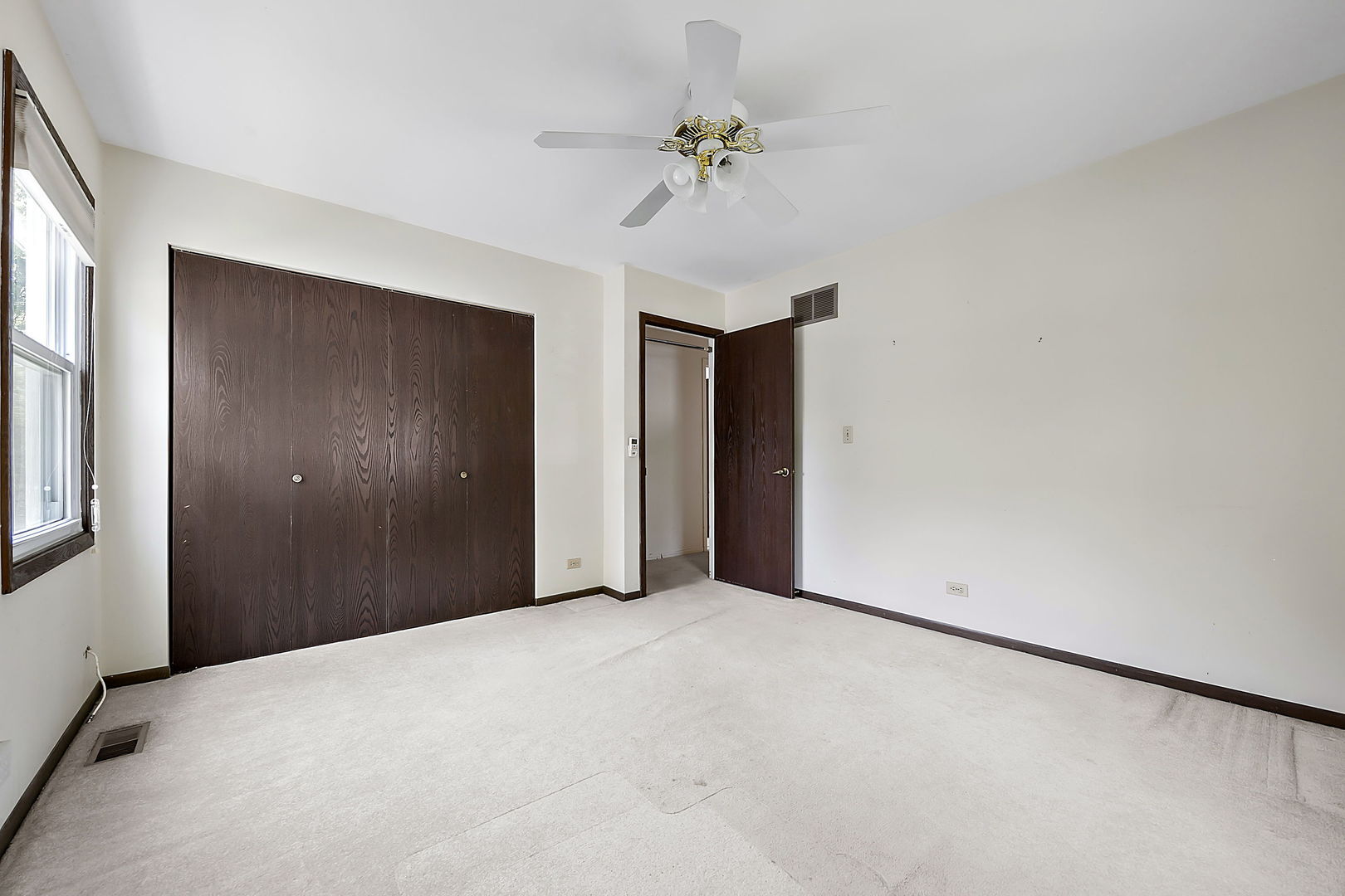 2080 Springside Drive Naperville, IL 60565 - Photo 22 of 31 a view of a hallway with a chandelier fan