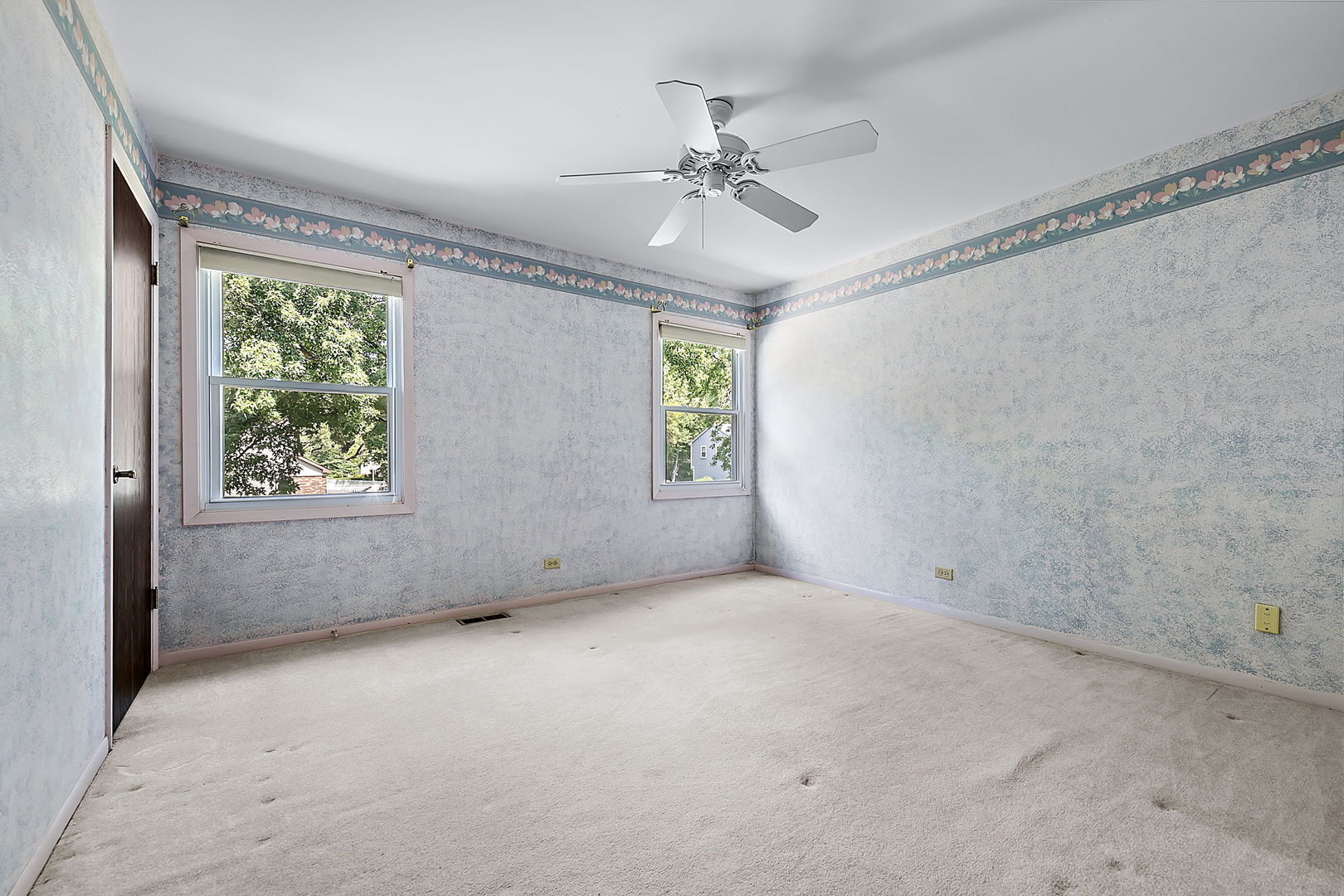 2080 Springside Drive Naperville, IL 60565 - Photo 28 of 31 an empty room with windows and fan