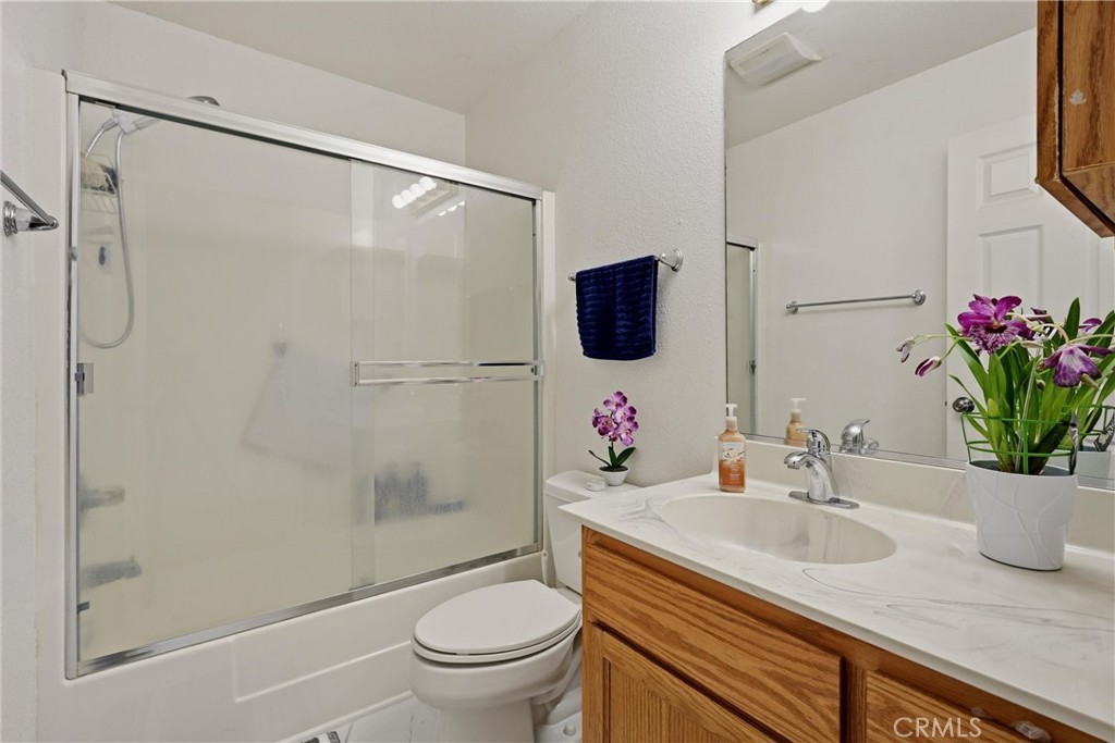 18685 Oak Grove Road Hidden Valley Lake, CA 95467 - Photo 12 of 52 a bathroom with a granite countertop sink toilet and shower