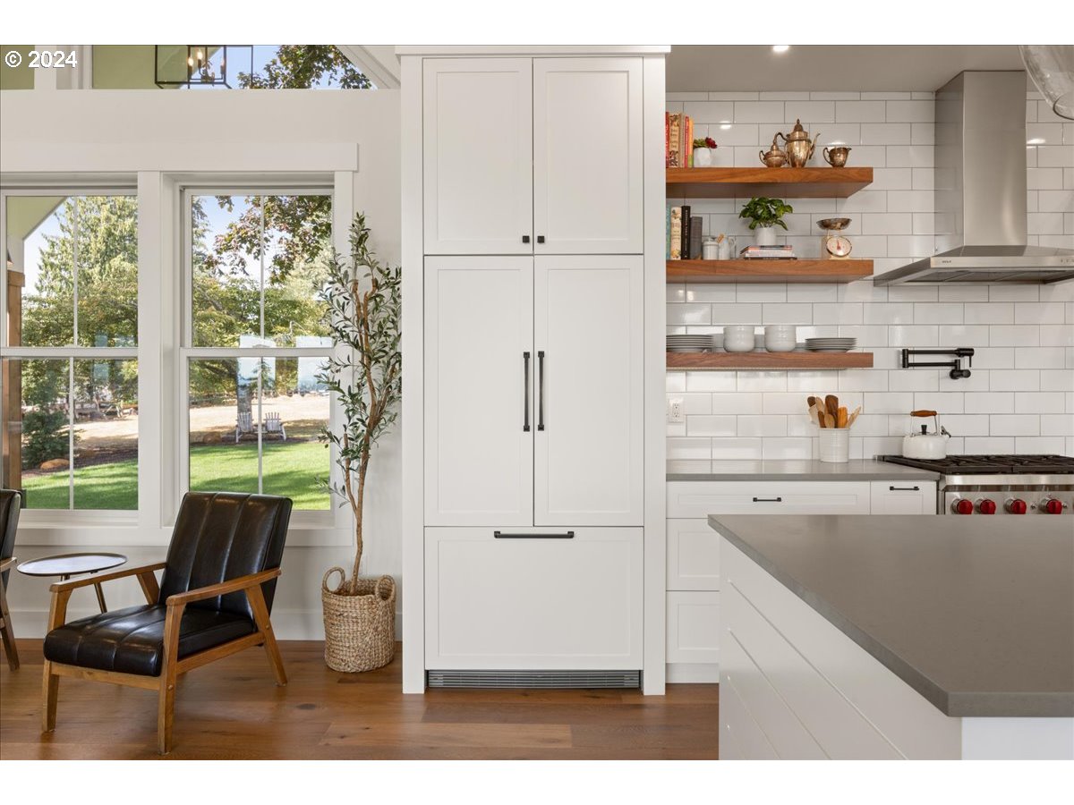 29050 Southwest Petes Mountain Road West Linn, OR 97068 - Photo 14 of 48 a kitchen with a refrigerator and a table