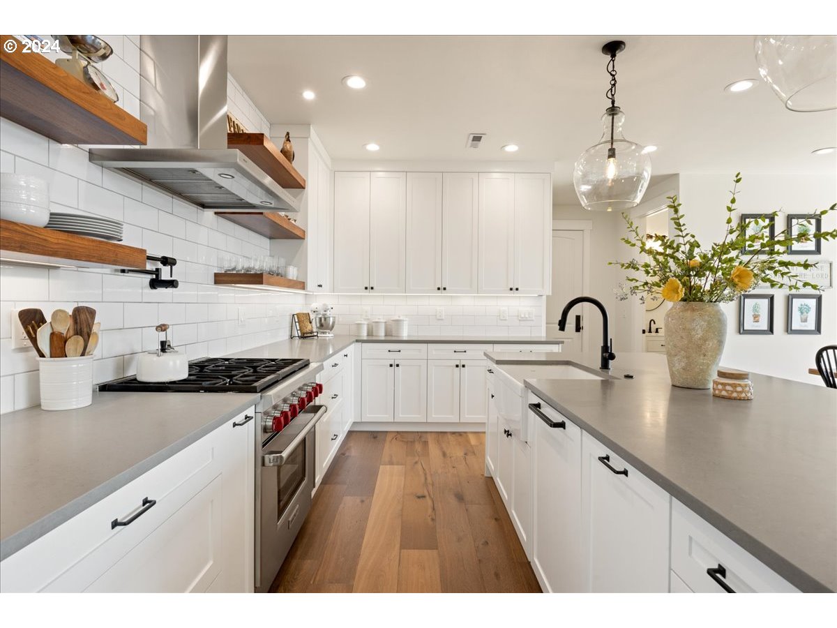 29050 Southwest Petes Mountain Road West Linn, OR 97068 - Photo 15 of 48 a kitchen with granite countertop a sink stainless steel appliances and cabinets