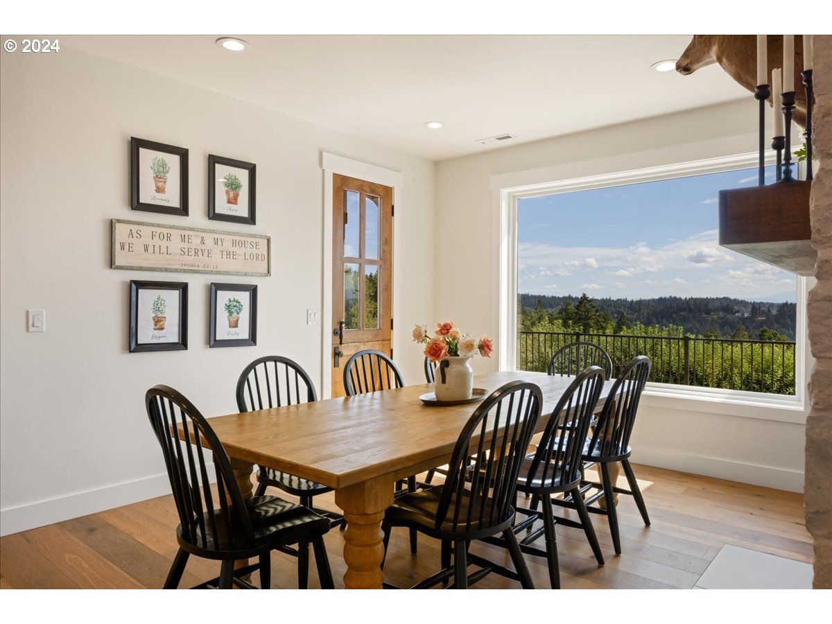29050 Southwest Petes Mountain Road West Linn, OR 97068 - Photo 18 of 48 a view of a dining room with furniture window and wooden floor