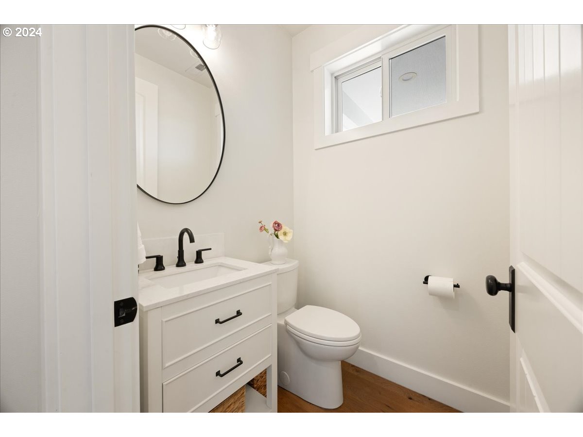 29050 Southwest Petes Mountain Road West Linn, OR 97068 - Photo 19 of 48 a bathroom with a sink a toilet and a mirror