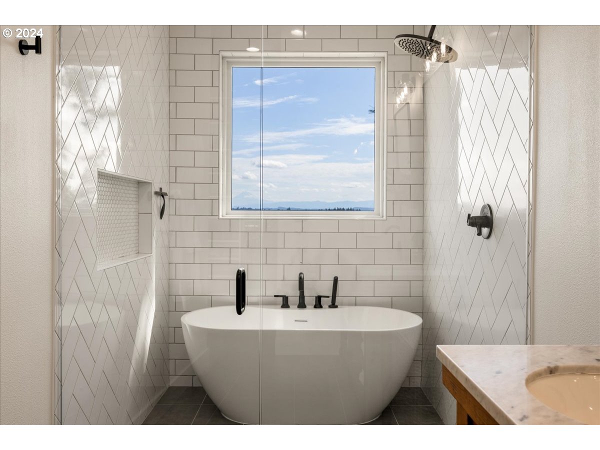 29050 Southwest Petes Mountain Road West Linn, OR 97068 - Photo 26 of 48 a bathroom with a bathtub and shower