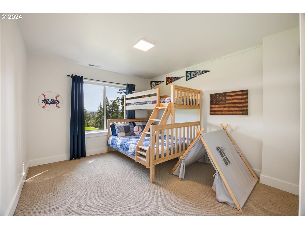 29050 Southwest Petes Mountain Road West Linn, OR 97068 - Photo 28 of 48 a bedroom with a bed and a window