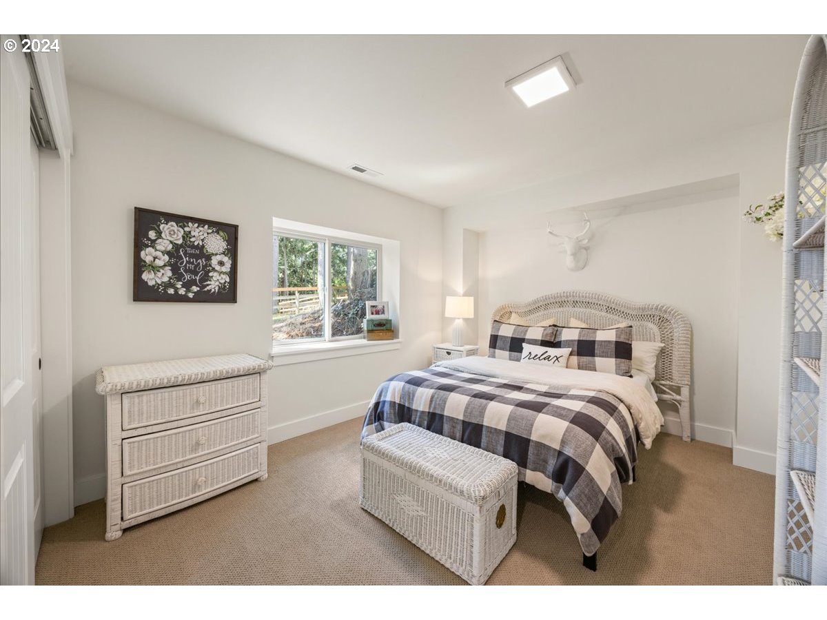 29050 Southwest Petes Mountain Road West Linn, OR 97068 - Photo 29 of 48 a bedroom with a bed and a dresser