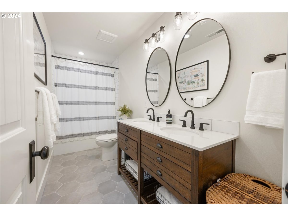 29050 Southwest Petes Mountain Road West Linn, OR 97068 - Photo 30 of 48 a bathroom with a double vanity sink mirror and a shower