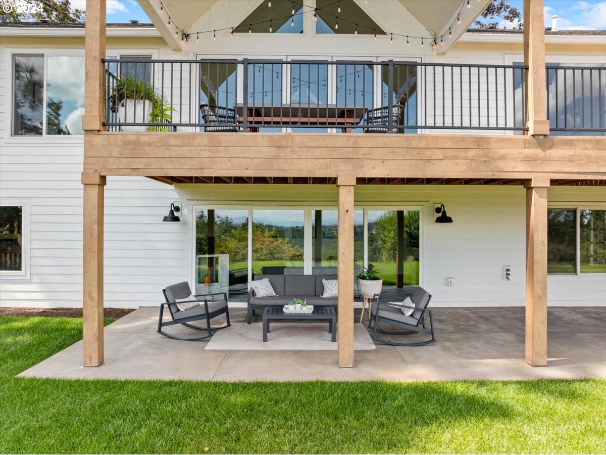 29050 Southwest Petes Mountain Road West Linn, OR 97068 - Photo 38 of 48 a backyard of a house with table and chairs