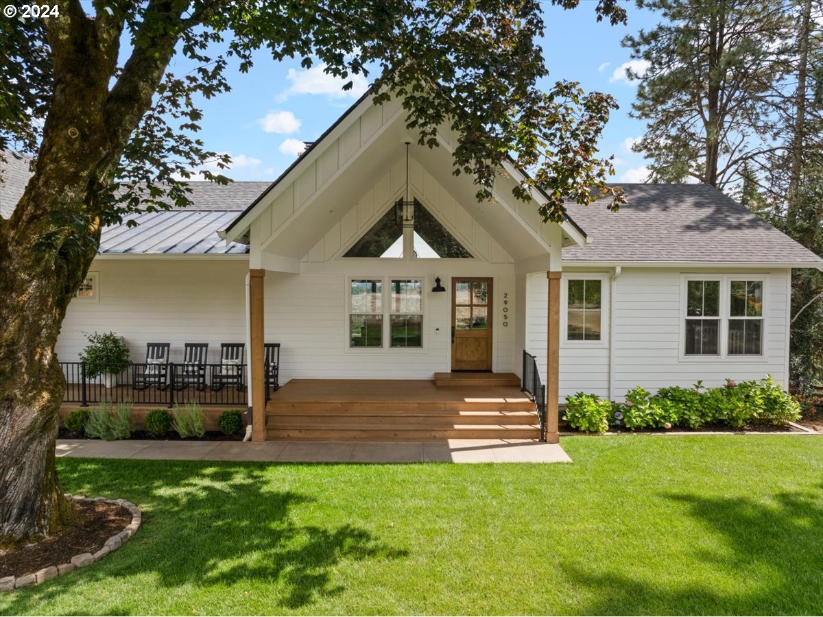 29050 Southwest Petes Mountain Road West Linn, OR 97068 - Photo 4 of 48 a front view of a house with a garden