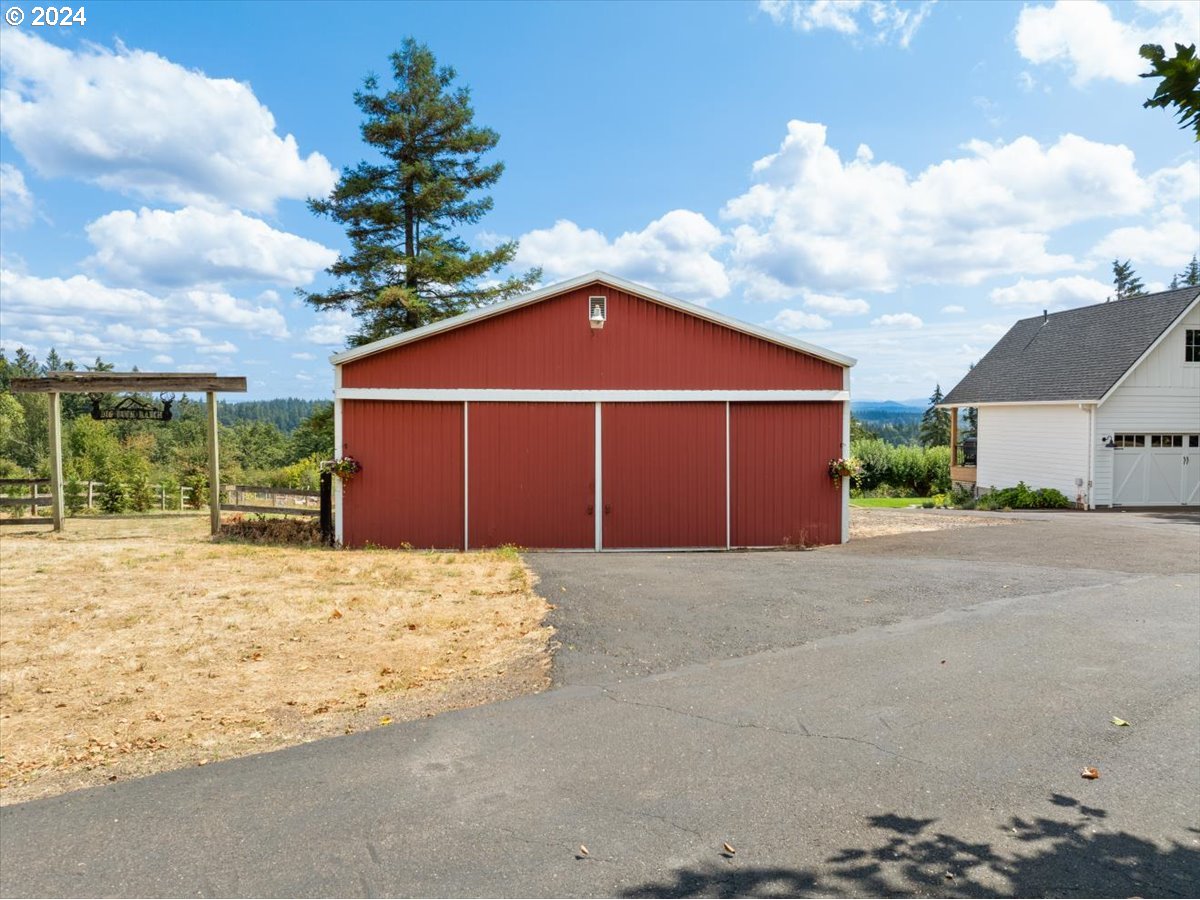 29050 Southwest Petes Mountain Road West Linn, OR 97068 - Photo 45 of 48 a front view of a house with a yard and garage