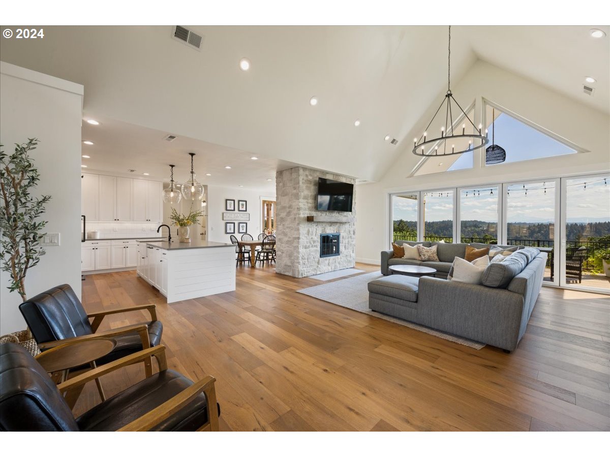 29050 Southwest Petes Mountain Road West Linn, OR 97068 - Photo 7 of 48 a living room with furniture and a large window