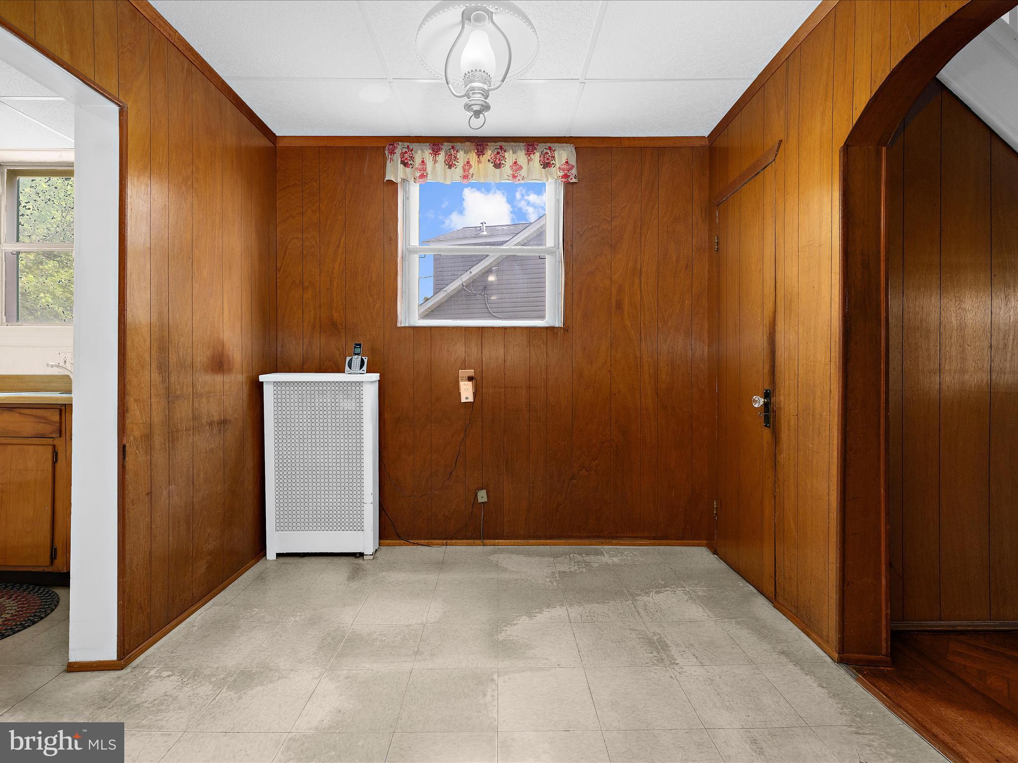5000 Levindale Road Baltimore, MD 21215 - Photo 16 of 60 an empty room with wooden floor and windows