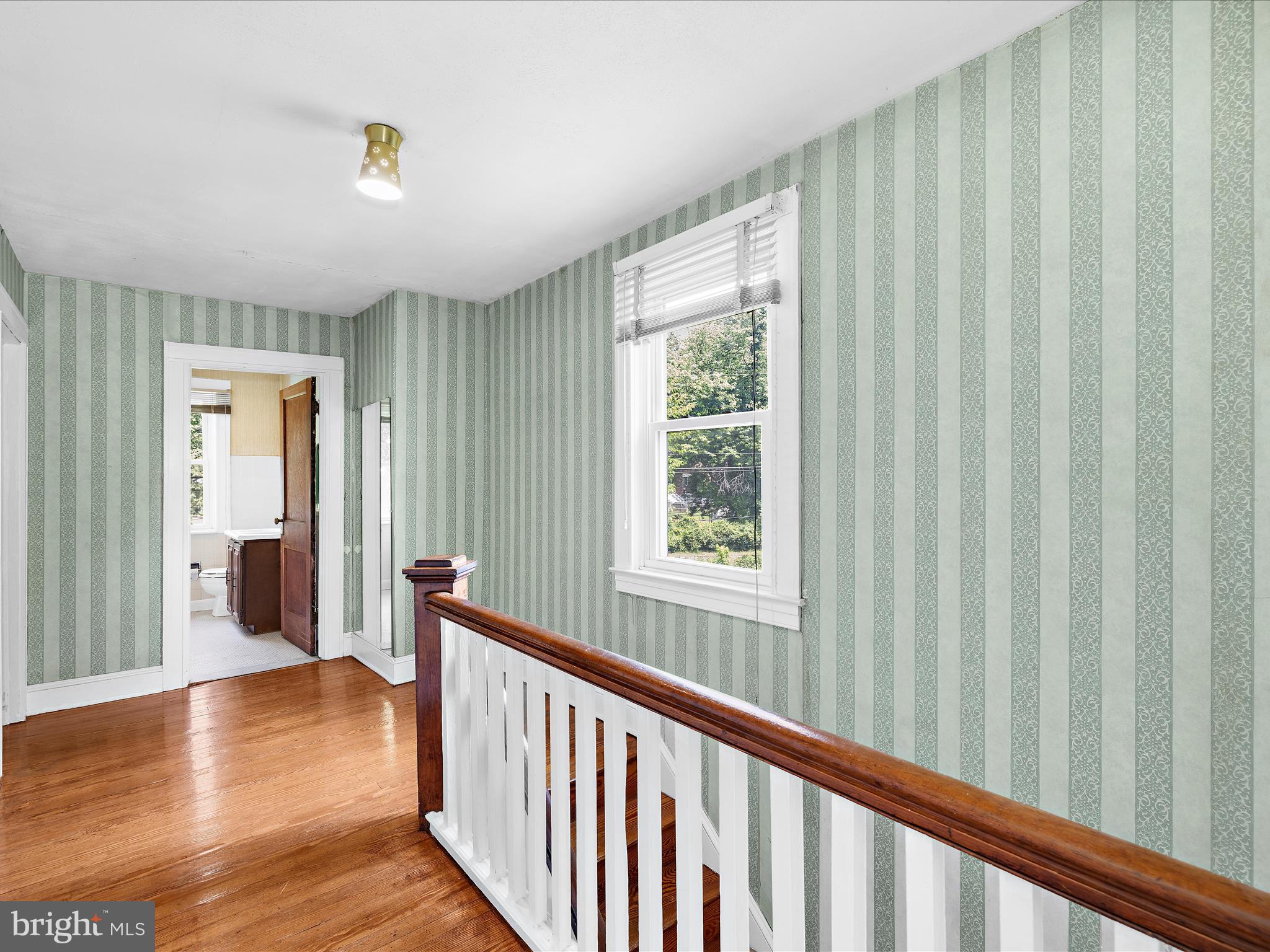 5000 Levindale Road Baltimore, MD 21215 - Photo 21 of 60 a view of a hallway with wooden floor and windows