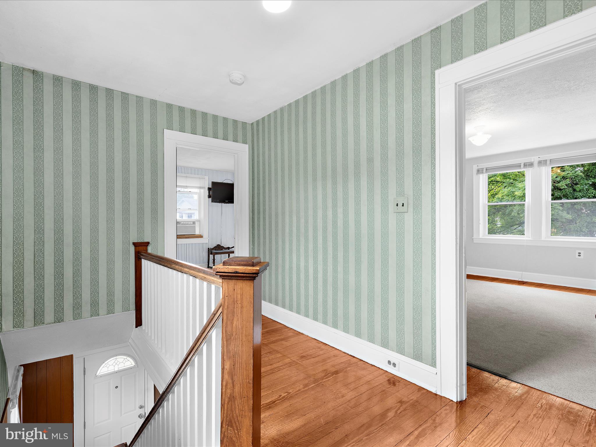 5000 Levindale Road Baltimore, MD 21215 - Photo 22 of 60 a view of a room with wooden floor and stairs