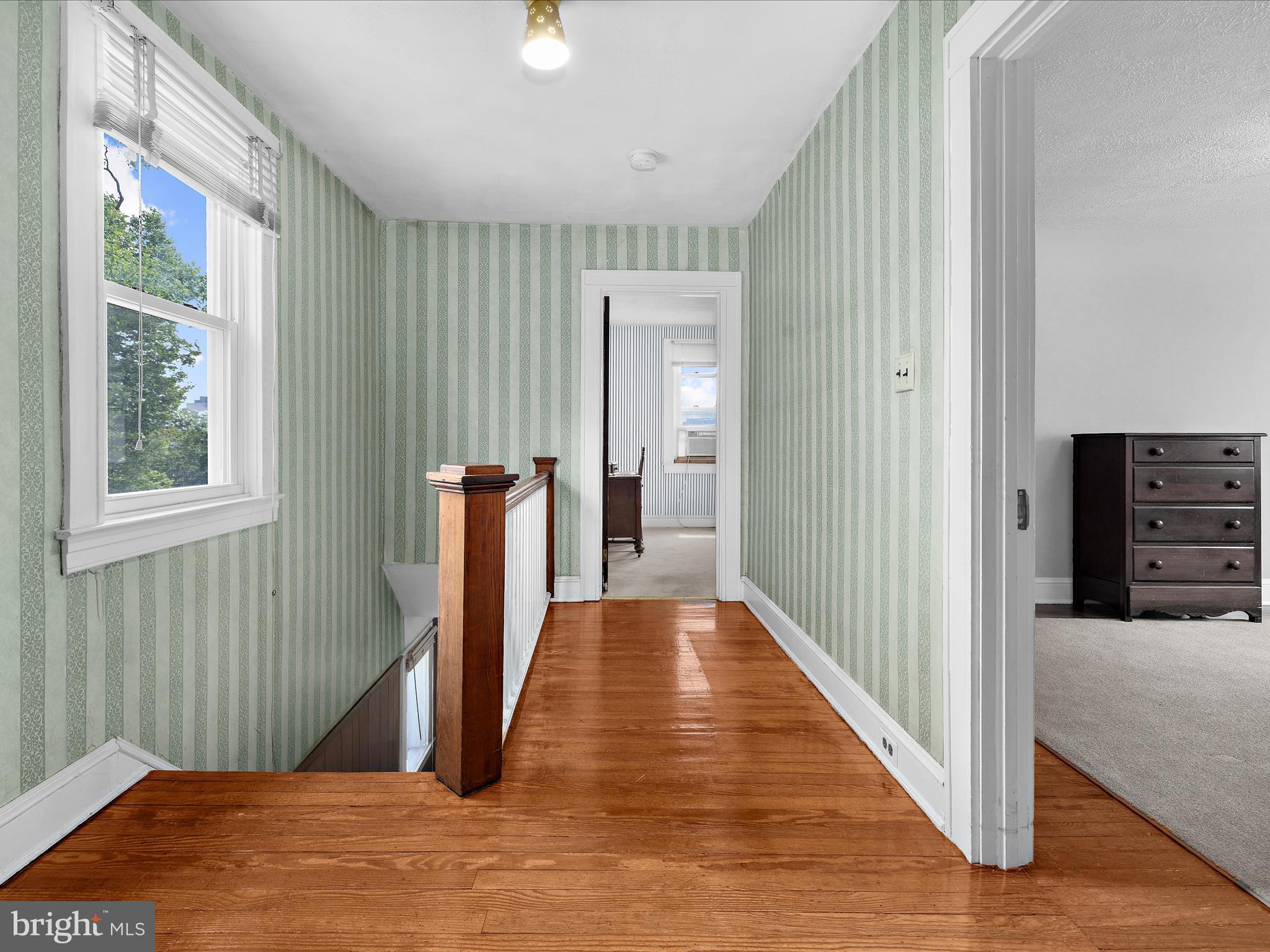 5000 Levindale Road Baltimore, MD 21215 - Photo 23 of 60 a view of a hallway with wooden floor and stairs
