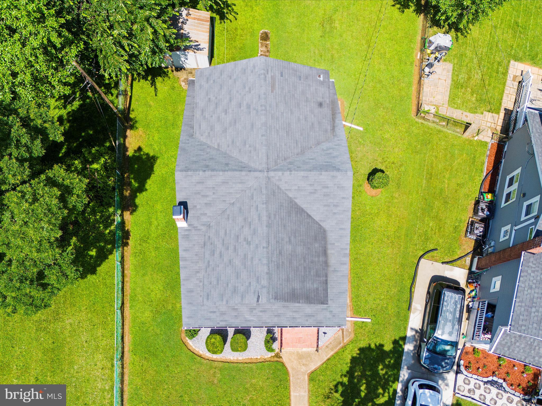 5000 Levindale Road Baltimore, MD 21215 - Photo 44 of 60 an aerial view of a house with swimming pool and large trees