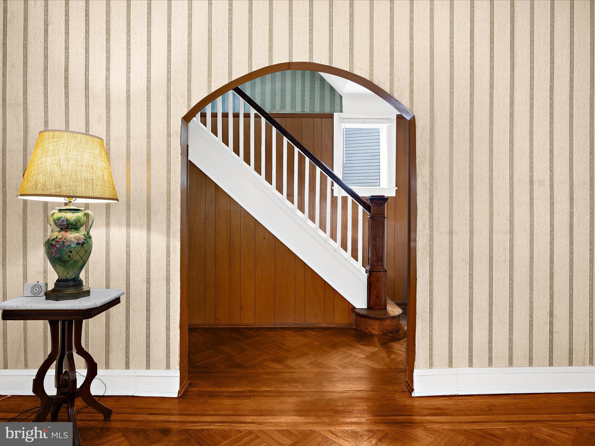 5000 Levindale Road Baltimore, MD 21215 - Photo 8 of 60 a view of a hallway with wooden floor and staircase