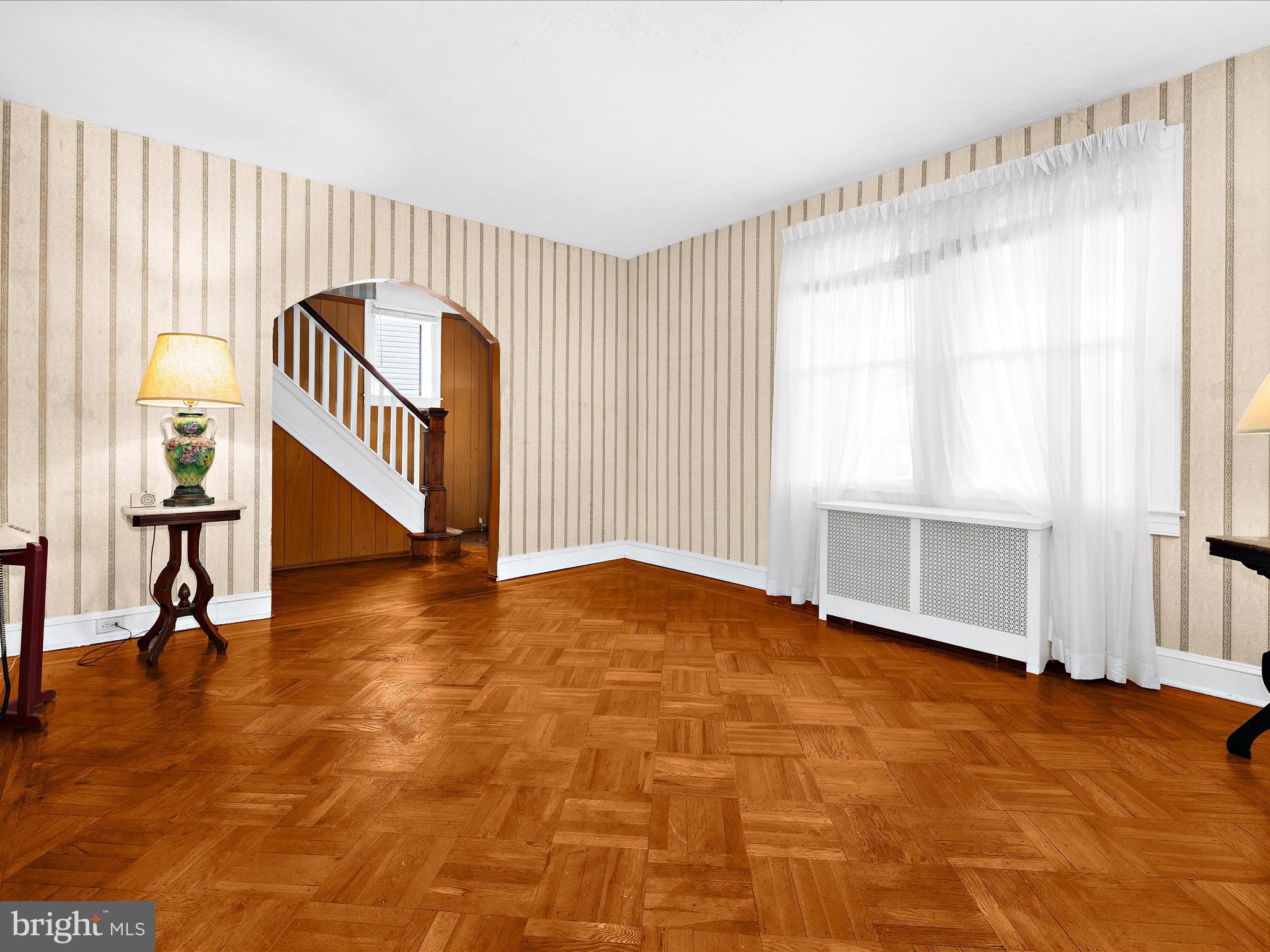 5000 Levindale Road Baltimore, MD 21215 - Photo 10 of 60 a view of an empty room with wooden floor and a window