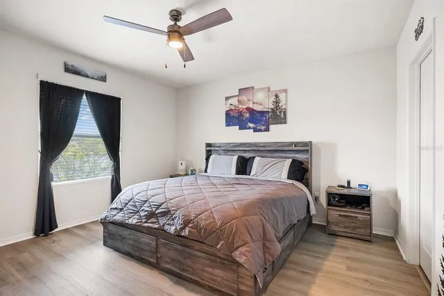 a bedroom with a bed and a window