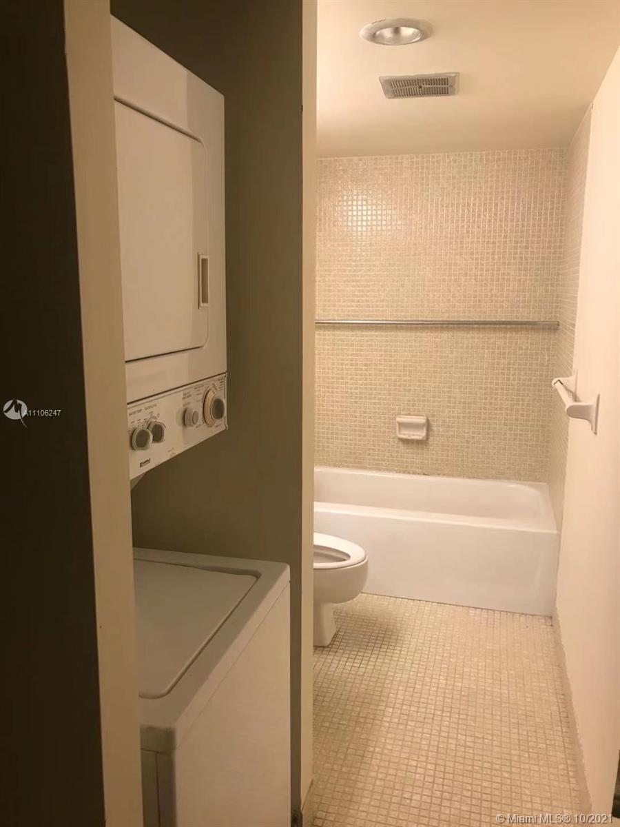 4172 Inverrary Drive, Unit 304 Lauderhill, FL 33319 - Photo 11 of 13 a bathroom with a tub and a shower