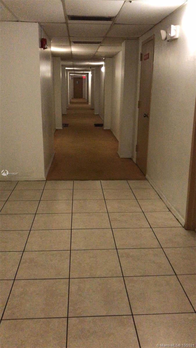 4172 Inverrary Drive, Unit 304 Lauderhill, FL 33319 - Photo 10 of 13 a view of a hallway with wooden floor