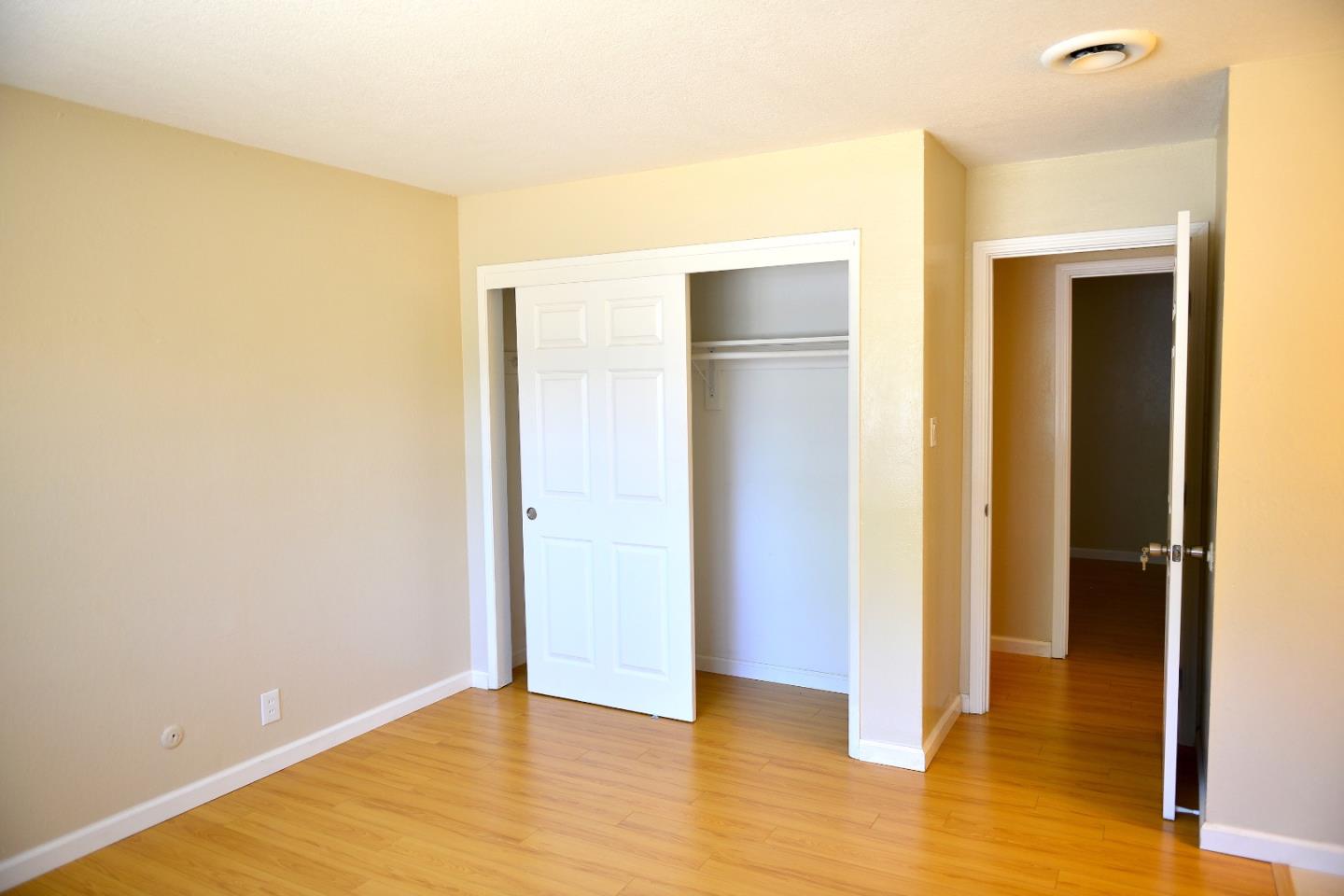 3817 Starview Drive San Jose, CA 95124 - Photo 4 of 15 a view of an empty room with wooden floor and a bathroom