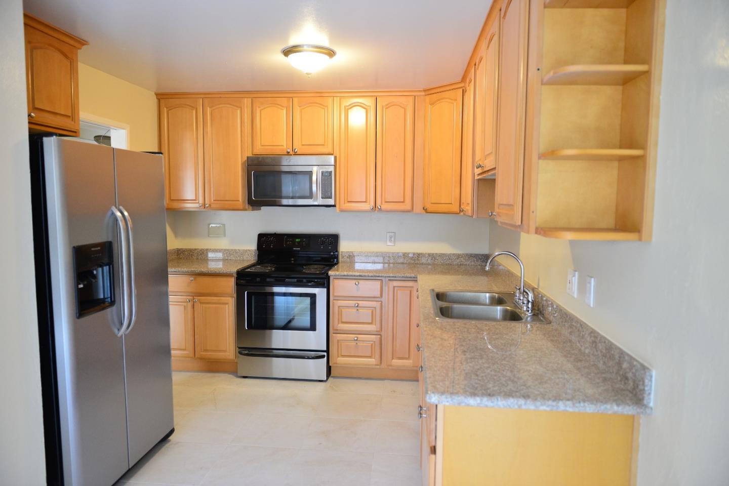 3817 Starview Drive San Jose, CA 95124 - Photo 6 of 15 a kitchen with a refrigerator and a sink