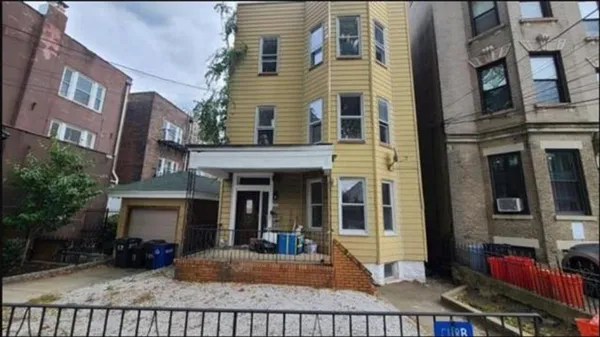 a view of a building with a porch