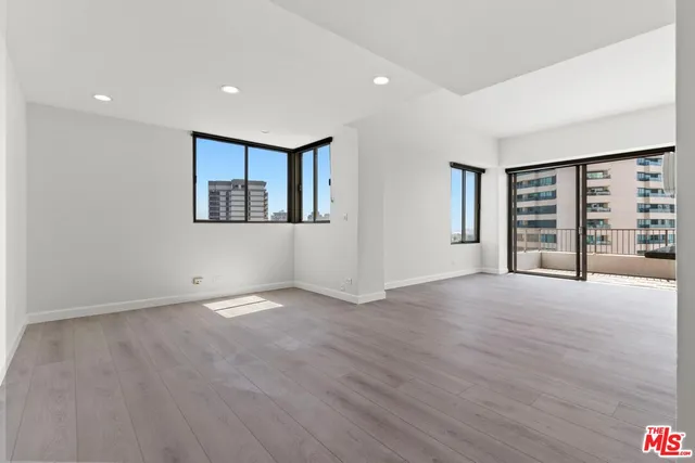 a bathroom with a granite countertop sink a toilet and bathtub