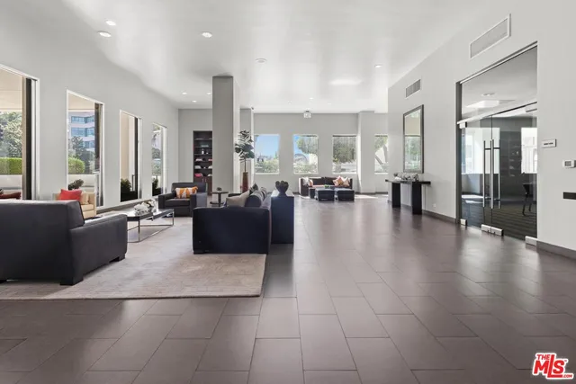 a swimming pool with outdoor seating and yard